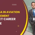 A smiling aviation student holding a diploma in front of an airport terminal.